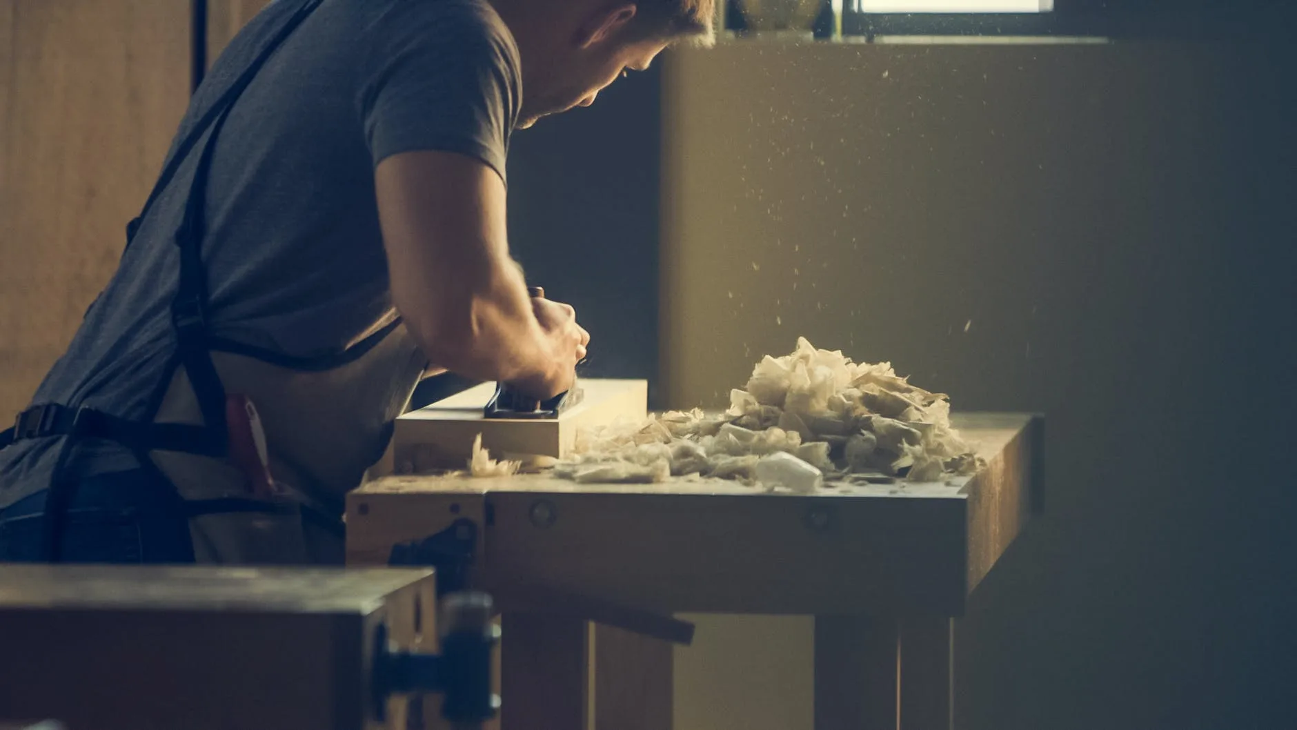 man person wooden table work