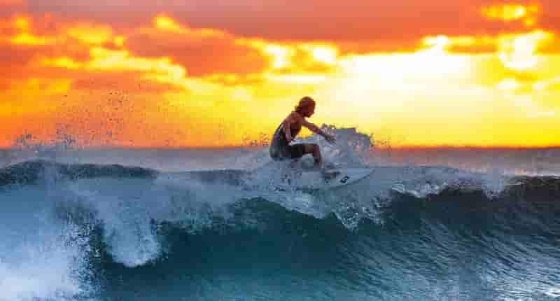 man surfing on waves