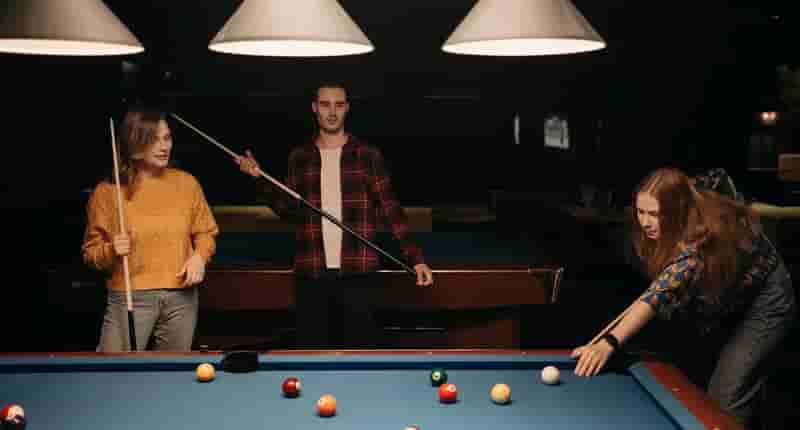 people playing billiards