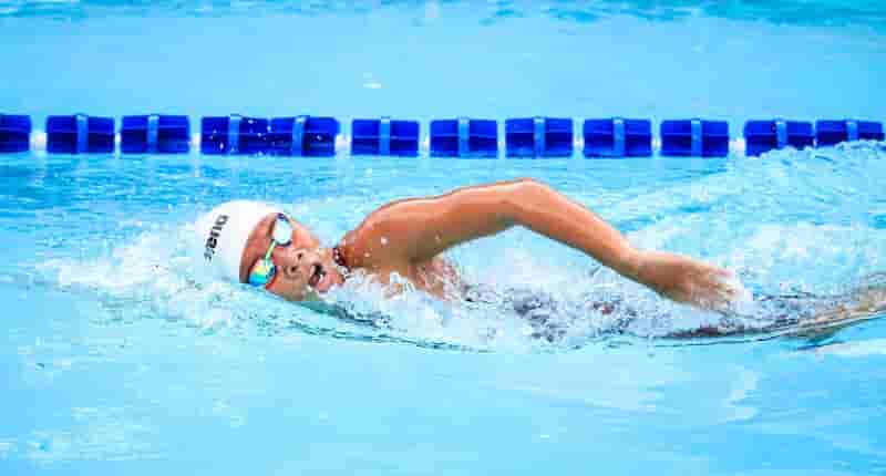 person swimming in body of water Jim De Ramos