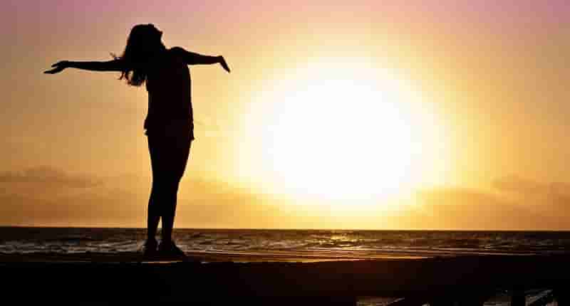 silhouette photo of woman against during golden hour