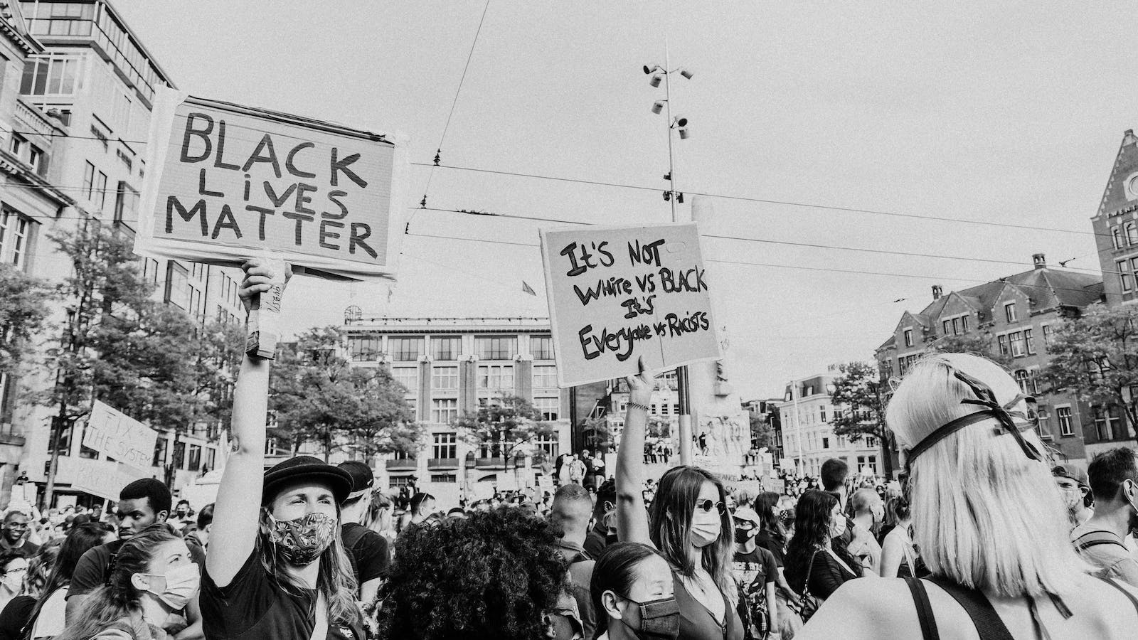 protesters holding signs