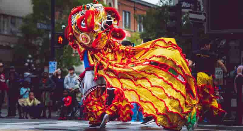 person wearing foo dog costume