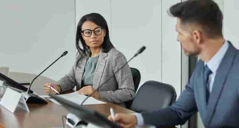 professional woman looking at colleague