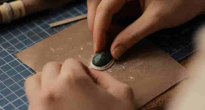 Person Polishing a Jewelry