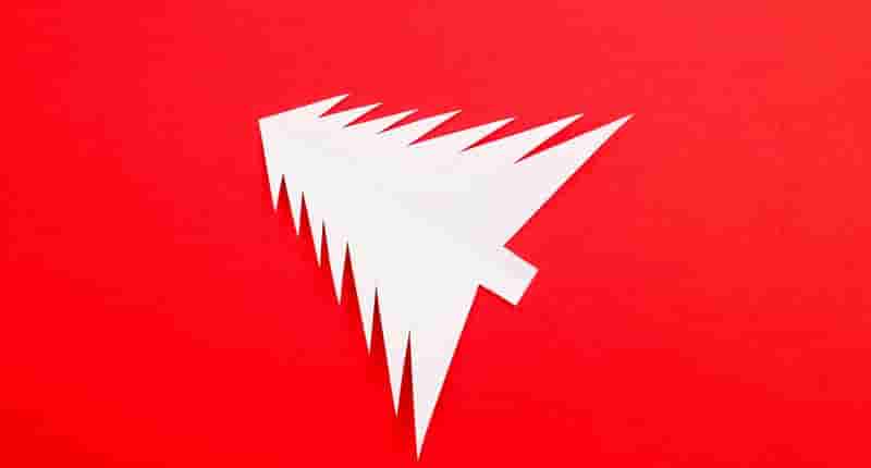 Christmas Tree Shaped Paper on Red Background