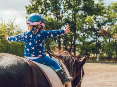 girl riding black horse