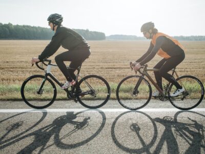 two people biking on the road