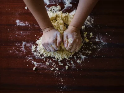 person mixing dough
